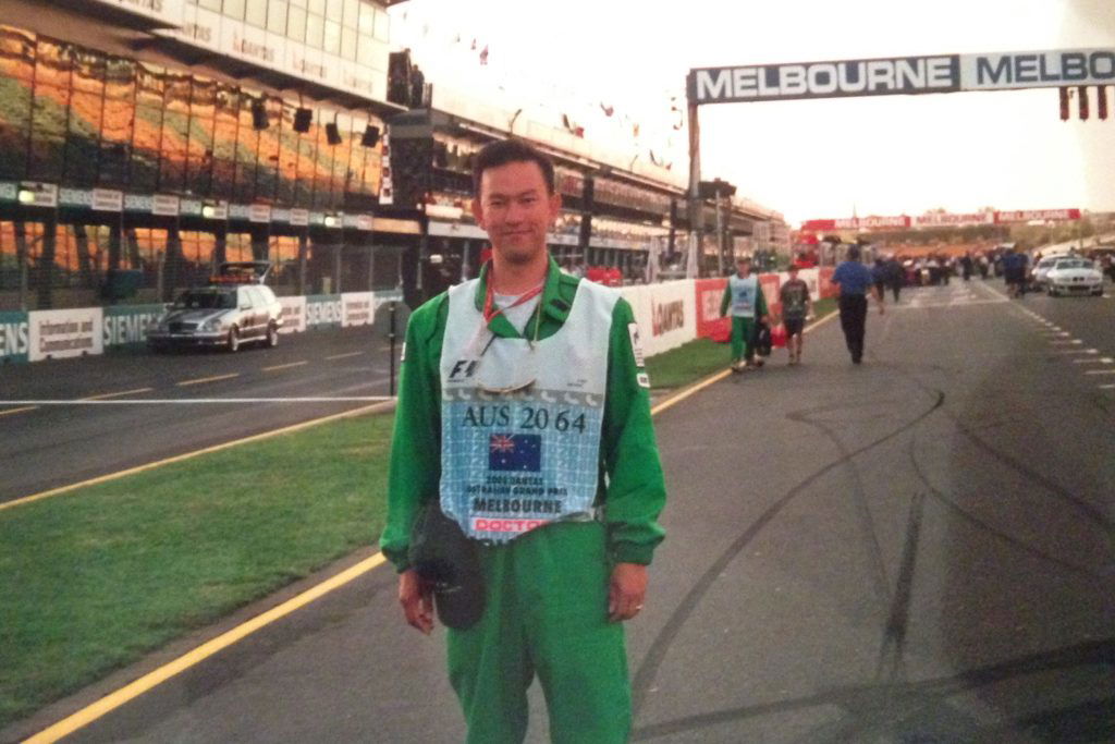 Dr Le's first motorsport event was the 1998 Formula 1 Australian Grand Prix, as a volunteer doctor (pictured here at the 2001 AGP). Image: Supplied