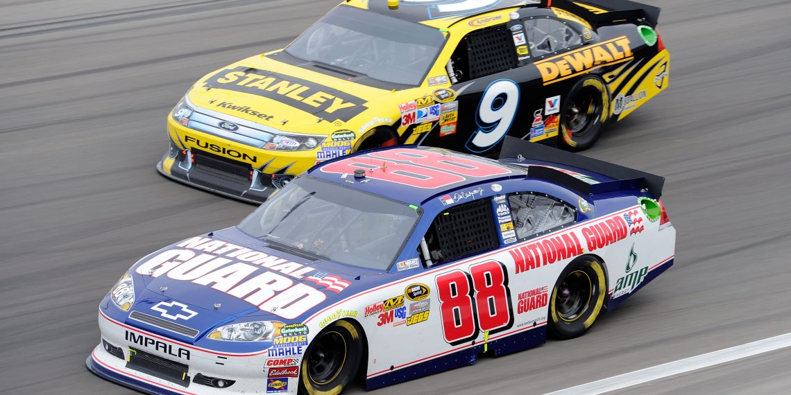 Dale Earnhardt Jr, driver of the #88 National Guard/Amp Energy Chevrolet, races Marcos Ambrose, driver of the #9 Stanley Ford, during the NASCAR Sprint Cup Series Kobalt Tools 400 at Las Vegas Motor Speedway in 2011.