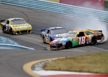 Kyle Busch spins off the nose of Brad Keselowski with Marcos Ambrose in tow.