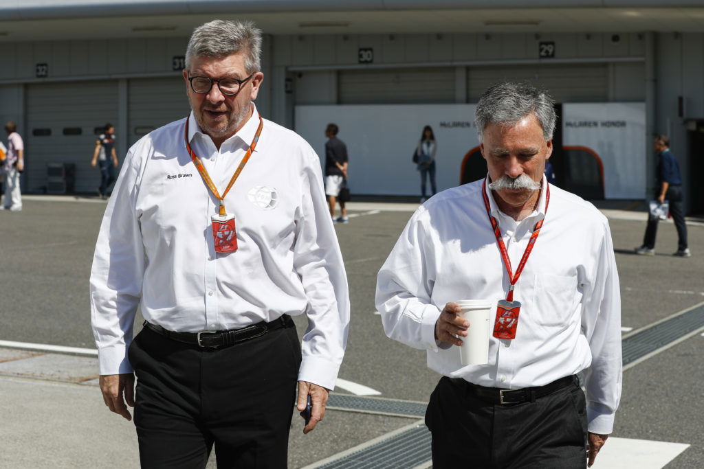 Fomula One's bosses Ross Brawn and Chase Carey