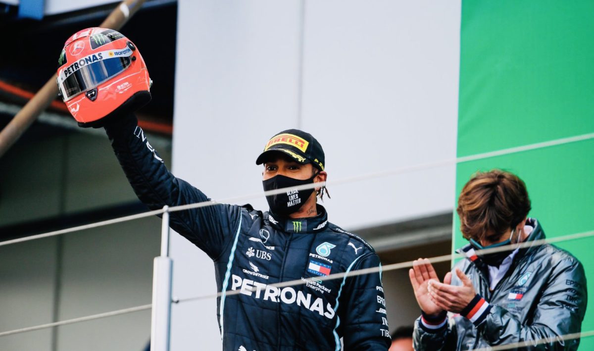 Hamilton presented with Schumacher helmet after record-equalling win
