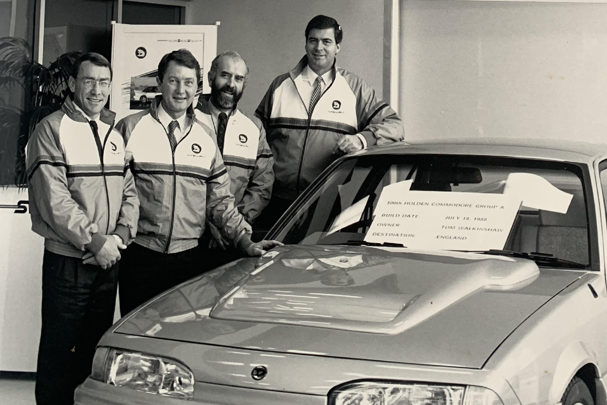 Larry Perkins, John Harvey, John Lindell, and John Crennan with the 500th HSV Commodore pic: John Crennan Selection