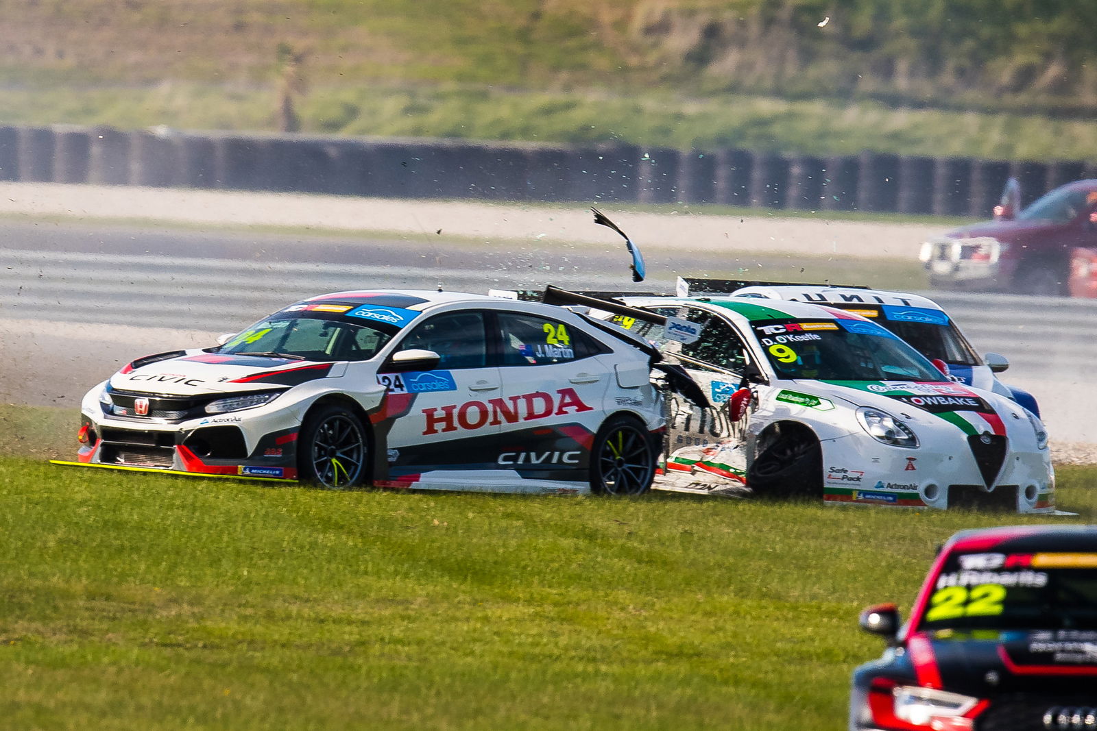 John Martin slams into the side of Dylan O'Keeffe at the start of Race 3 at Phillip Island