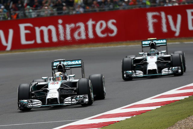 Hamilton cuts Rosberg lead with home win