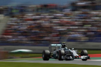 Rosberg holds off charging Hamilton in Austria