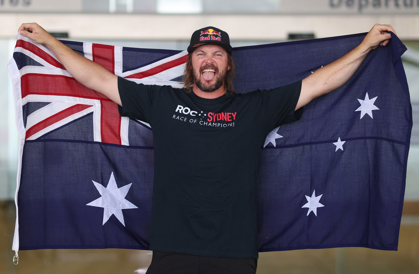 Toby Price draped in an Austalian flag.