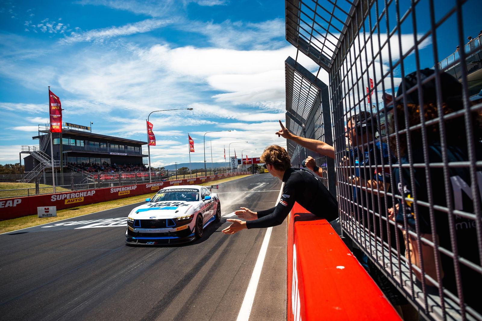 George Miedecek celebrates after winning at Mount Panorama in GT4 Australia.