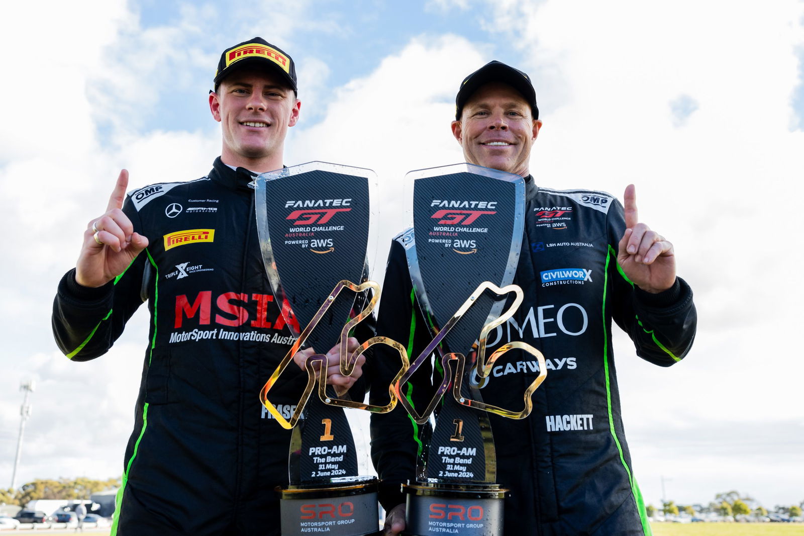 Declan Fraser (left) with Peter Hackett at The Bend Motorsport Park after winning the first Fanatec GT World Challenge Australia Powered by AWS race.