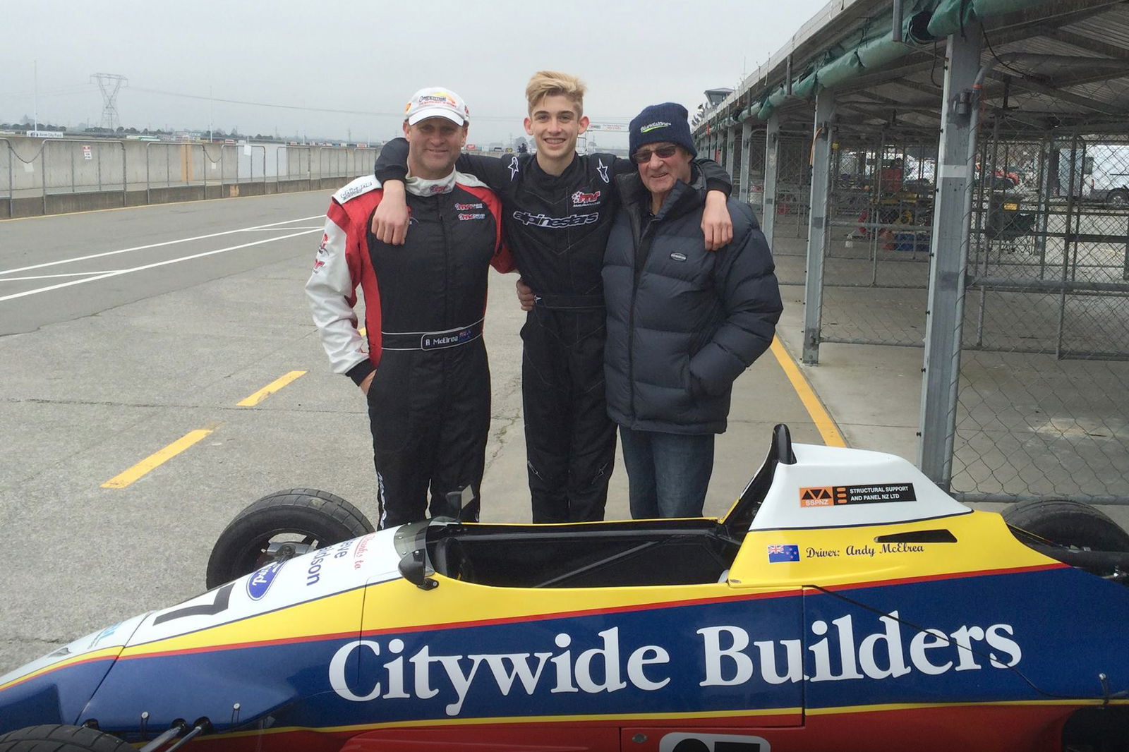 Andy McElrea, Hunter McElrea, and Rod McElrea with Andy's Formula Ford championship winner.