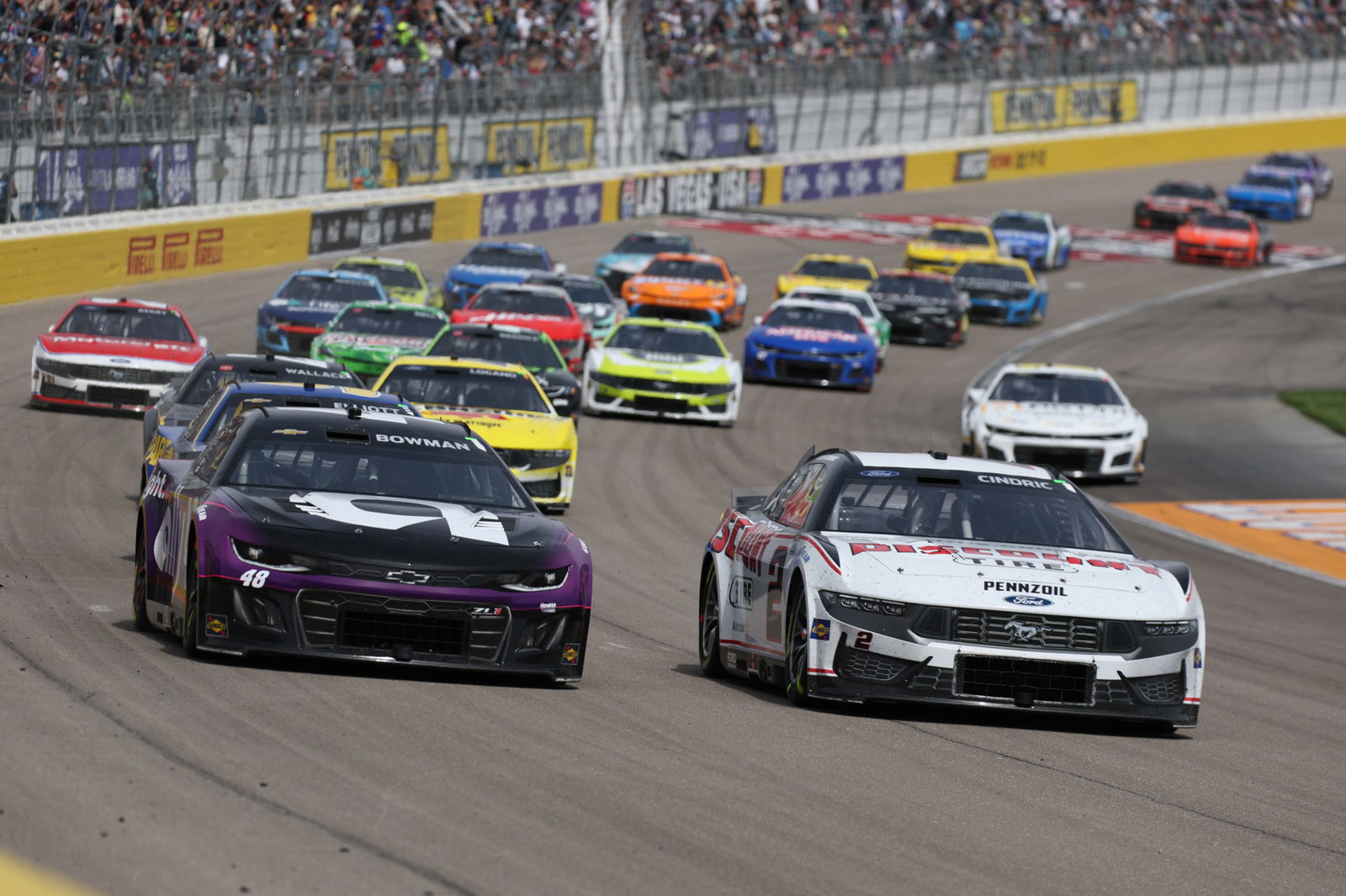 Austin Cindric, driver of the #2 Discount Tire Ford, races Alex Bowman, driver of the #48 Ally Chevrolet, during the NASCAR Cup Series Pennzoil 400 at Las Vegas Motor Speedway on March 16, 2025 in Las Vegas, Nevada.