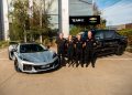 (From left) GM officials Chris Payne and Jess Bala with Team 18 owner Charlie Schwerkolt and team principal Adrian Burgess.