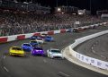 Joey Logano, driver of the #22 Shell Pennzoil Ford, Christopher Bell, driver of the #20 Yahoo! Toyota, and Denny Hamlin, driver of the #11 Mavis Tire Toyota, race during the NASCAR Cup Series All-Star Race at North Wilkesboro Speedway on May 19, 2024 in North Wilkesboro, North Carolina.