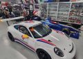 Harry Walker's Porsche next to the iconic BAR F1 car owned by his father Campbell. Image: Supplied