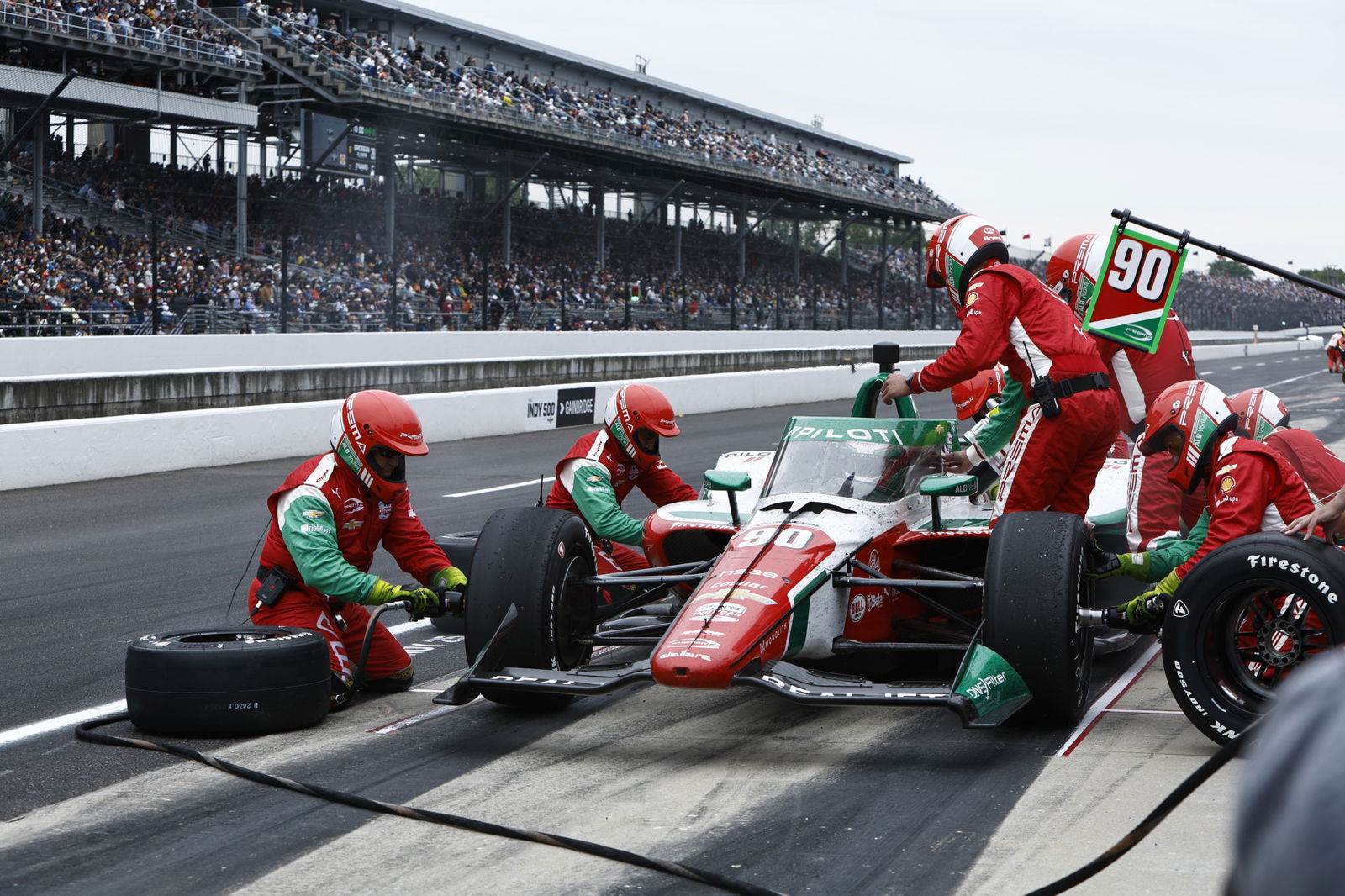 Prema Racing performs a pit stop on the #90 car during the 109th Indianapolis 500. 
