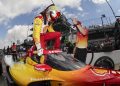 Josef Newgarden jumps into his car during practice for the 2025 Indianpolis 500.