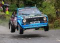 Frank Kelly's Ford Escort 'Baby Blue' flies through the air.