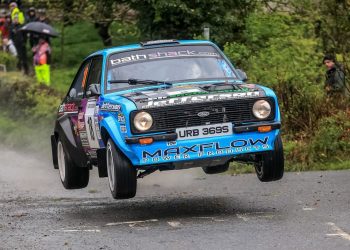Frank Kelly's Ford Escort 'Baby Blue' flies through the air.