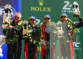 Matt Campbell (second from left) on the 24 Hours of Le Mans podium with his Porsche Penske Motorsport teammates.