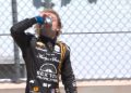 AJ Foyt Racing's Santino Ferrucci swigs a beer after finishing third in the Xpel Grand Prix of Road America.