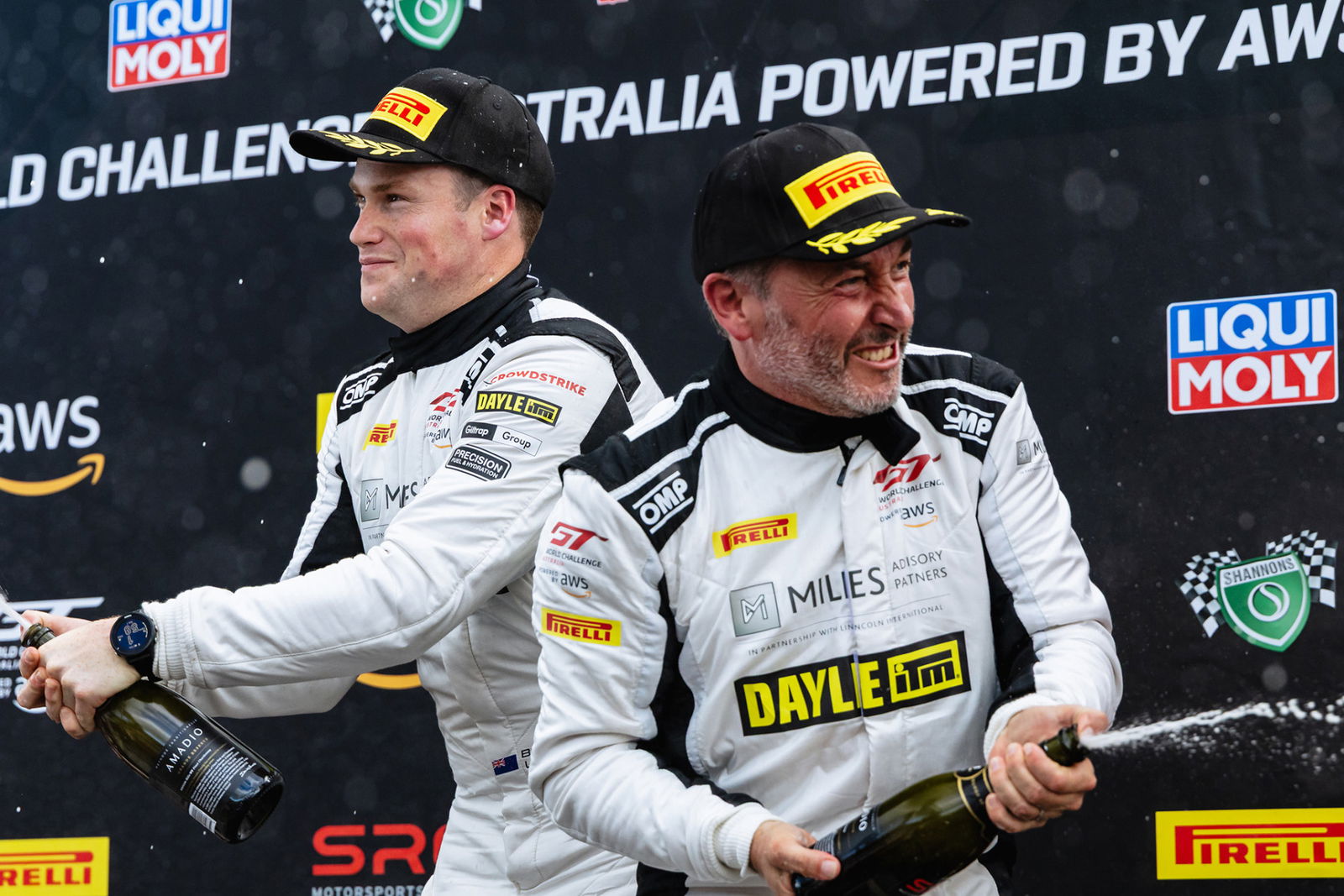 Tim Miles celebrates a podium finish with GT World Challenge Australia co-driver Brendon Leitch at Queensland Raceway. 