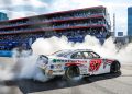 Shane van Gisbergen celebrates winning the NASCAR Xfinity Series race at Chicago in 2024.