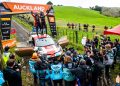 Kalle Rovanpera stands on top of his Toyota Yaris Rally1 car after winning Rally New Zealand in 2022.