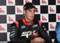 Shane van Gisbergen in a Stone Brothers Racing race suit talks in a press conference.