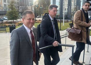 Front Row Motorsports owner Bob Jenkins, left, and 23XI co-owner Denny Hamlin arrive in the Western District of North Carolina on Monday Dec 1, 2025 in Charlotte, N.C. (AP Photo/Jenna Fryer, File)