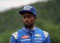 Rajah Caruth, driver of the #71 HendrickCars.com Chevrolet, walks the grid during practice for the NASCAR Craftsman Truck Series LiUNA! 150 at Lime Rock Park on June 27, 2025 in Lakeville, Connecticut. (Photo by Jonathan Bachman/Getty Images) | Getty Images