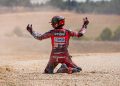 Francesco Bagnaia reacts after crashing with Alex Marquez.