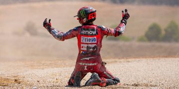 Francesco Bagnaia reacts after crashing with Alex Marquez.