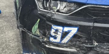 Shane van Gisbergen's #97 Camaro ended up worse for wear thanks to contact on restarts during his drive to victory at Portland. Image: Kaulig Racing Facebook