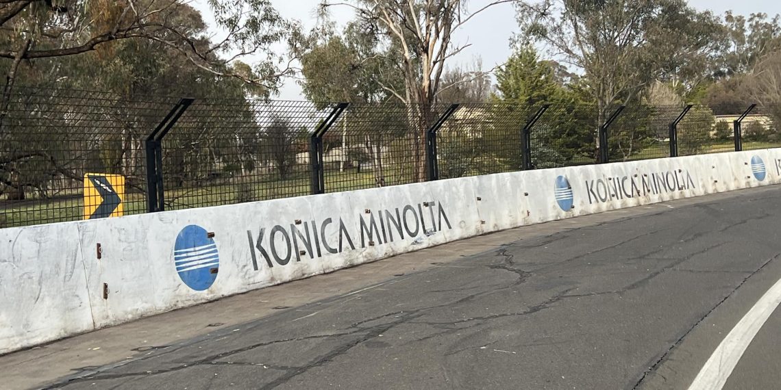 The removal of the tyre barrier at Griffins Bend exposes two decade old signage. Image: Schumacher Motorsport via Facebook