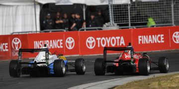 Liam Lawson passes Marcus Armstrong around the outside at Highlands Motorsport Park. Image: Bruce Jenkins