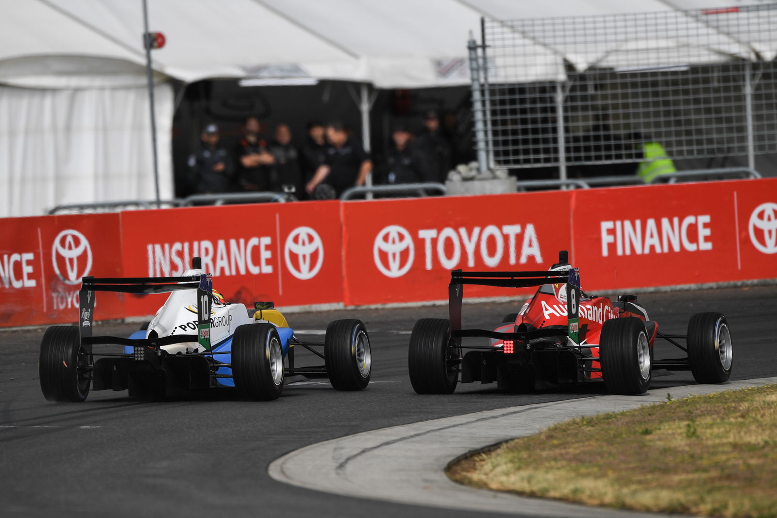 Liam Lawson passes Marcus Armstrong around the outside at Highlands Motorsport Park. Image: Bruce Jenkins