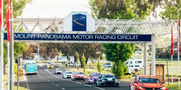 TCR cars drive from Mount Panorama to downtown Bathurst.