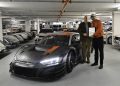 Audi's Chris Reinke hands over the final car to Michael Doppelmayr.