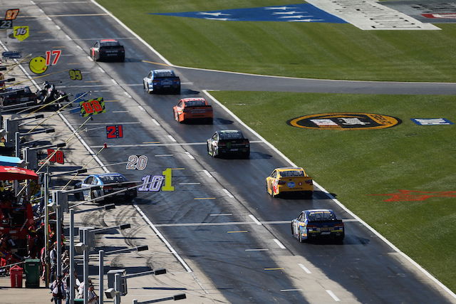 Pit road prepares for a flurry of activity during the Atlanta NASCAR Sprint Cup race won by Jimmie Johnson 