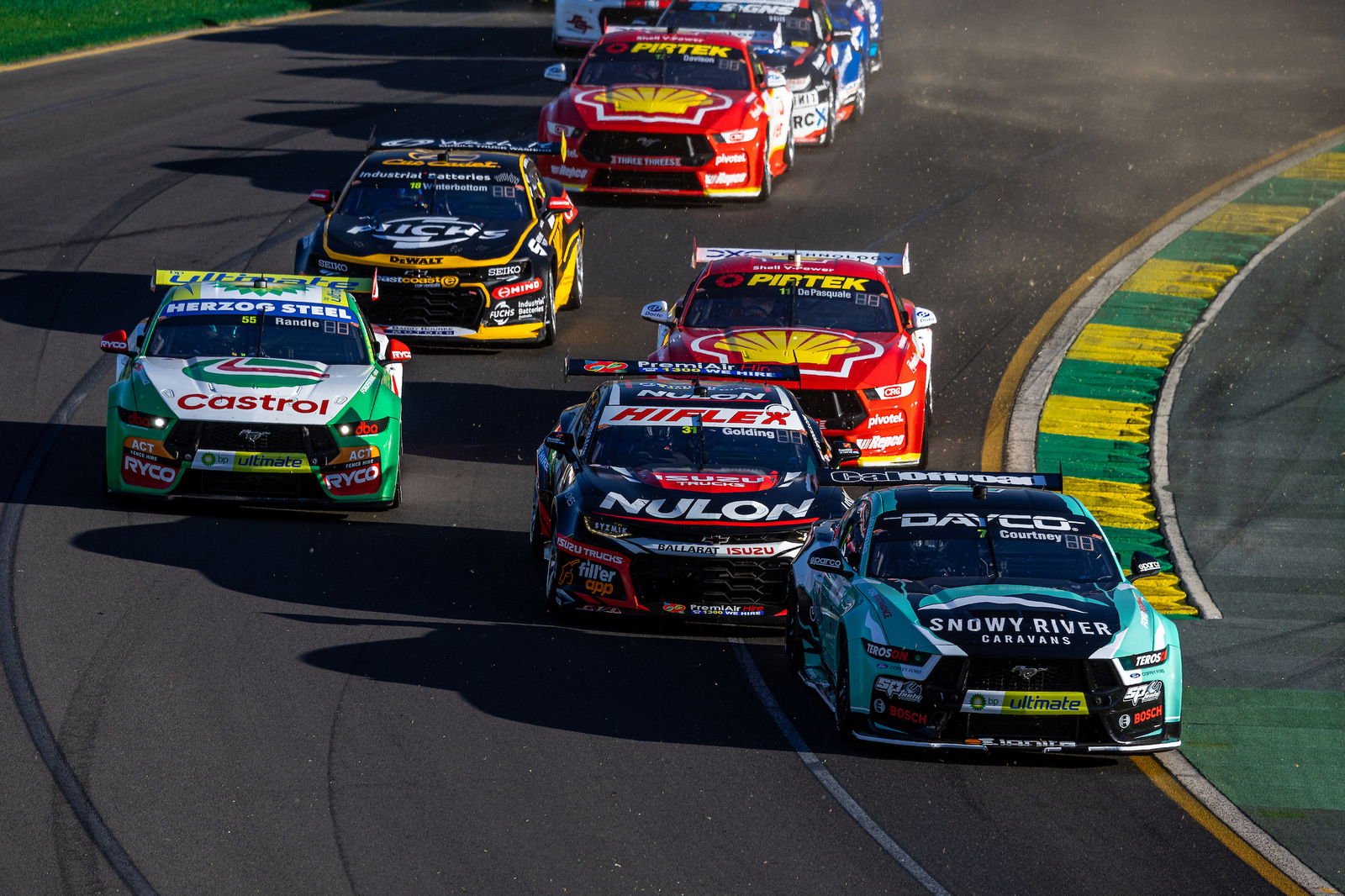 A group of Supercars at the Albert Park Grand Prix Circuit.