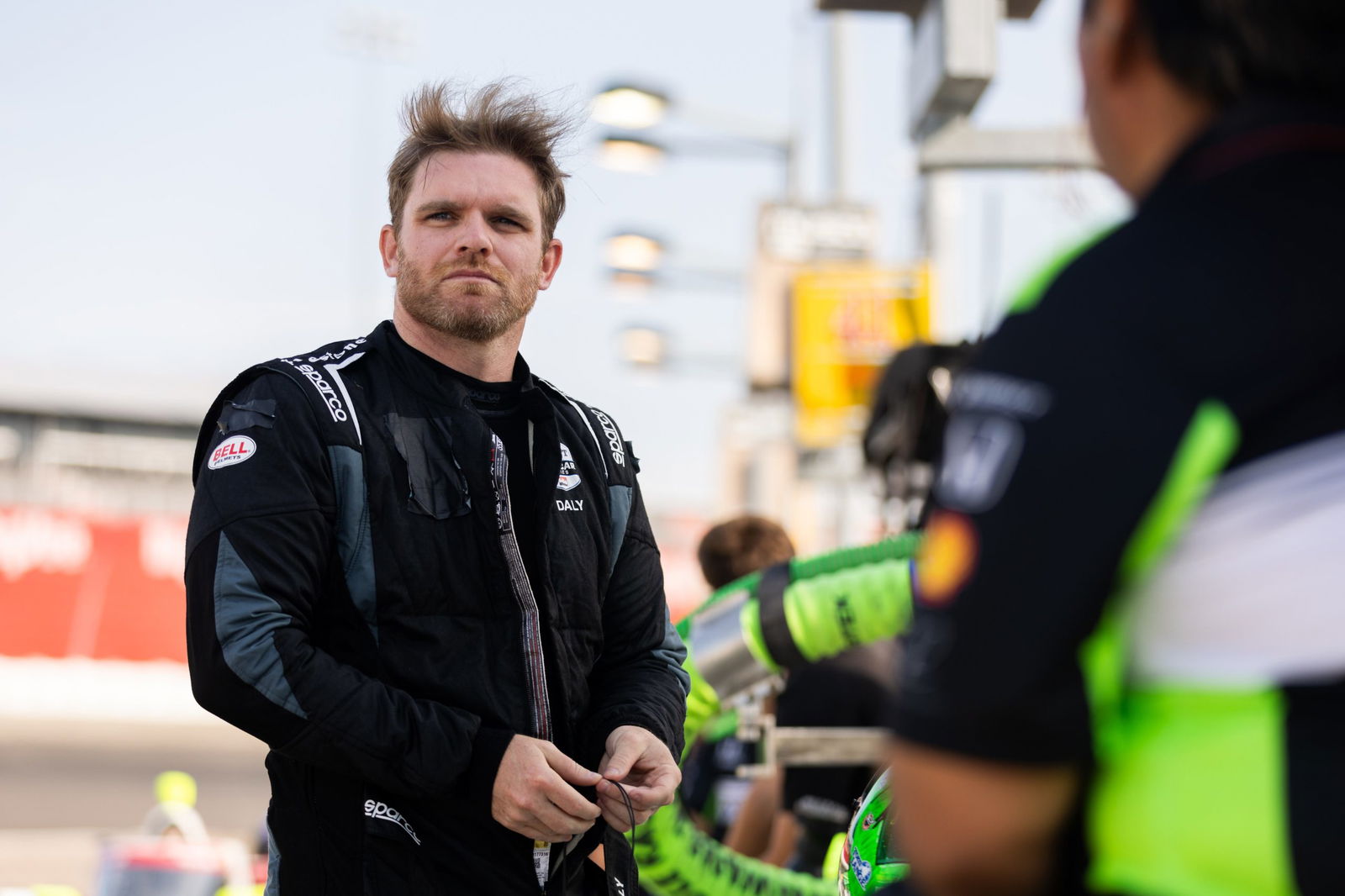 Conor Daly stands in the pit lane at Gateway.