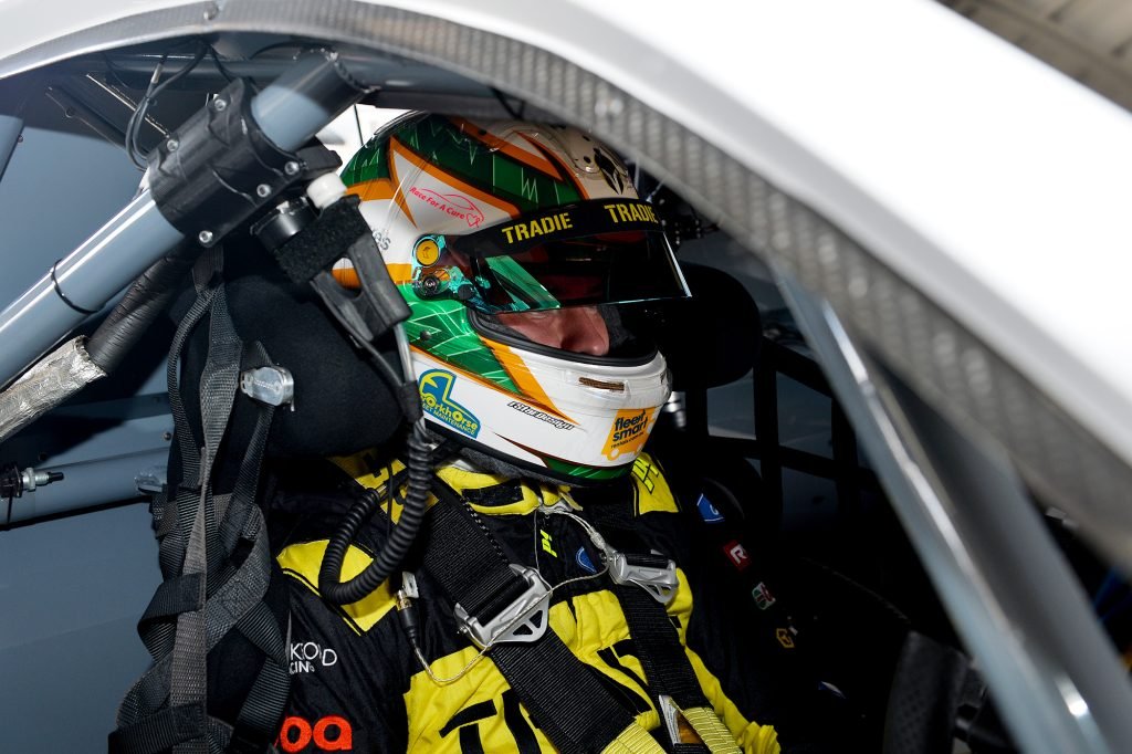 Tyler Everingham sits in Thomas Randle's Ford Mustang. Image: Russell Colvin