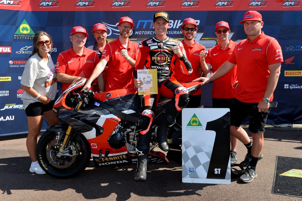 Troy Herfoss celebrates a victory with the now former factory Honda ASBK team. Image: Russell Colvin