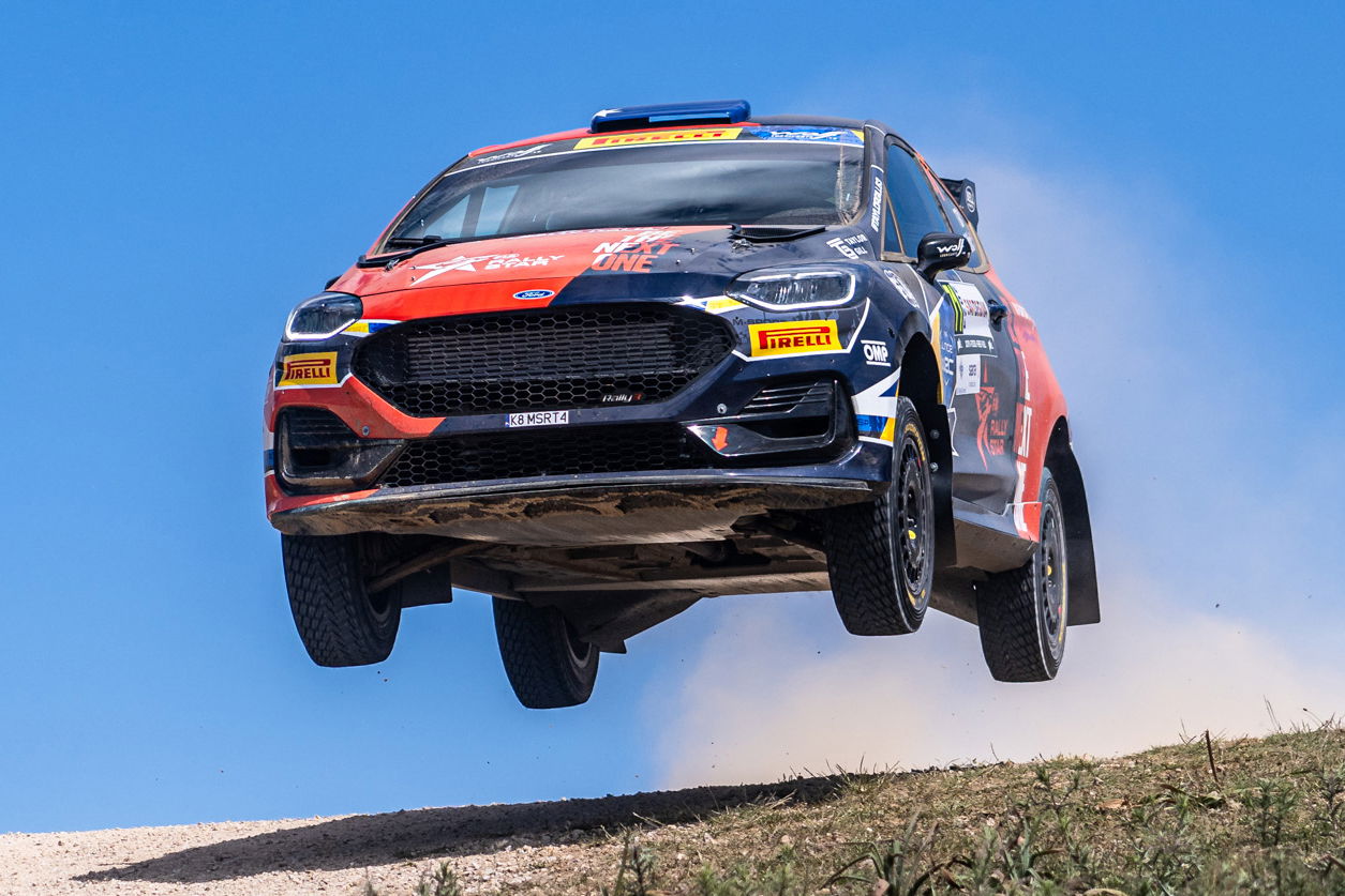 Taylor Gill flies through the air in his Ford Fiesta Rally3.