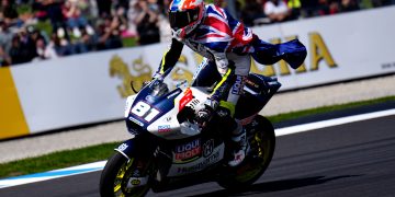 Senna Agius celebrates finishing third in Moto2 at the Australian Motorcycle Grand Prix.