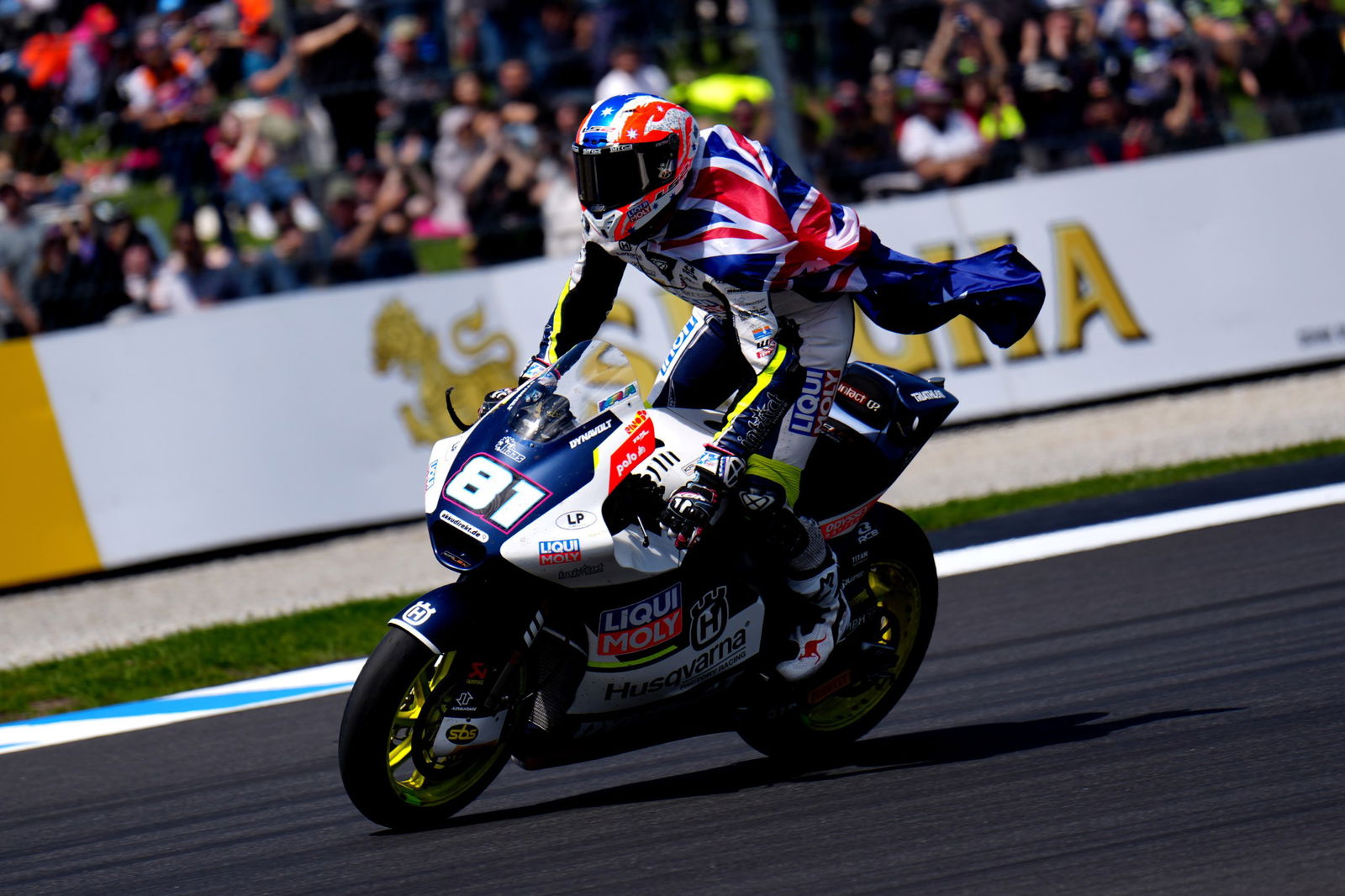 Senna Agius celebrates finishing third in Moto2 at the Australian Motorcycle Grand Prix.