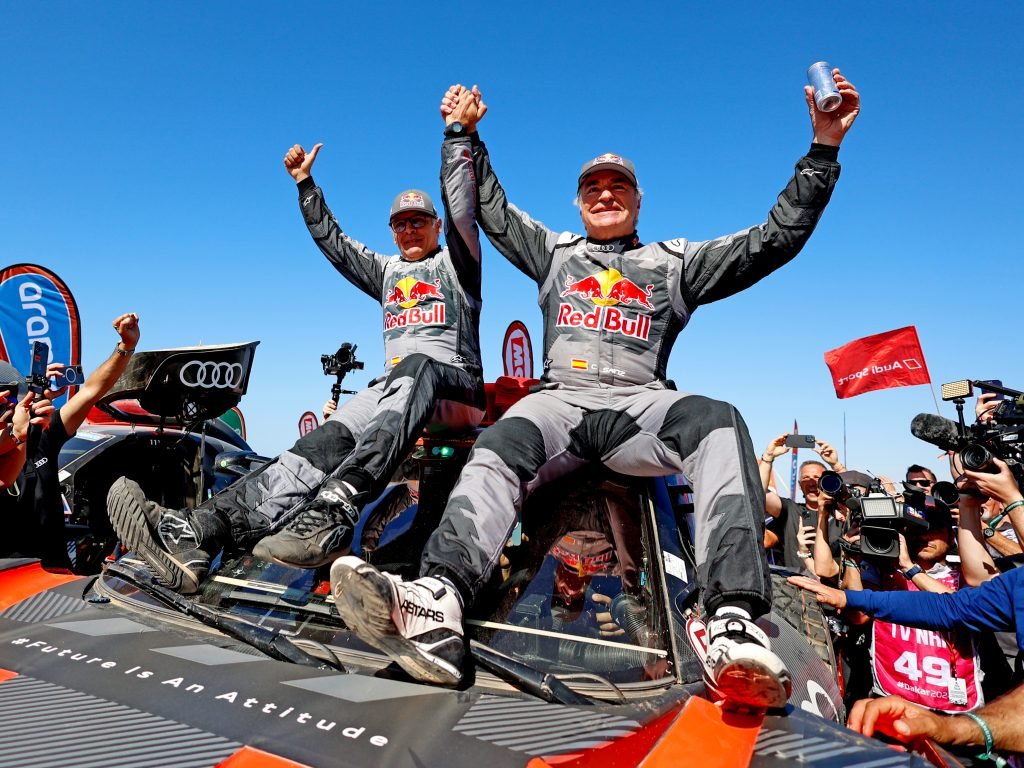 Carlos Sainz (right of shot) and navigator Lucas Cruz are the 2024 Dakar Rally champions. Image: Team Audi Sport Twitter