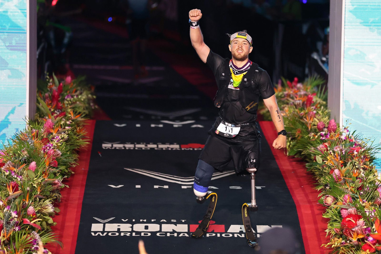 Billy Monger celebrates completing the Ironman World Championship in Hawaii.