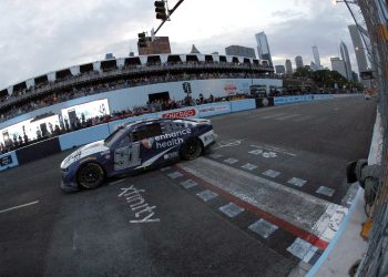 CHICAGO, ILLINOIS - JULY 02: Shane Van Gisbergen, driver of the #91 Enhance Health Chevrolet, crosses the finish line to win the NASCAR Cup Series Grant Park 220 at the Chicago Street Course on July 02, 2023 in Chicago, Illinois. (Photo by Sean Gardner/Getty Images)