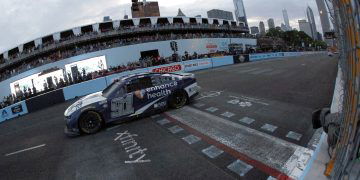 CHICAGO, ILLINOIS - JULY 02: Shane Van Gisbergen, driver of the #91 Enhance Health Chevrolet, crosses the finish line to win the NASCAR Cup Series Grant Park 220 at the Chicago Street Course on July 02, 2023 in Chicago, Illinois. (Photo by Sean Gardner/Getty Images)