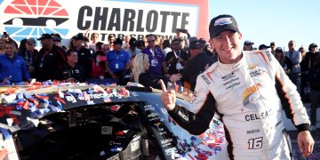 CONCORD, NORTH CAROLINA - OCTOBER 08: AJ Allmendinger, driver of the #16 Celsius Chevrolet, poses next to his winner sticker in victory lane after winning the NASCAR Cup Series Bank of America ROVAL 400 at Charlotte Motor Speedway on October 08, 2023 in Concord, North Carolina. (Photo by Jared C. Tilton/Getty Images)